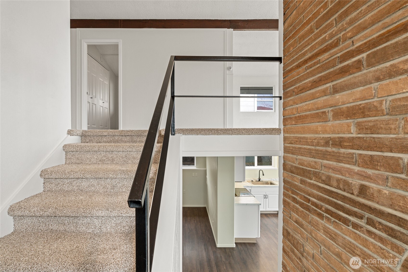 314 West 3rd Street Omak, WA 98841 - Photo 7 of 28 a view of staircase with white walls and railing