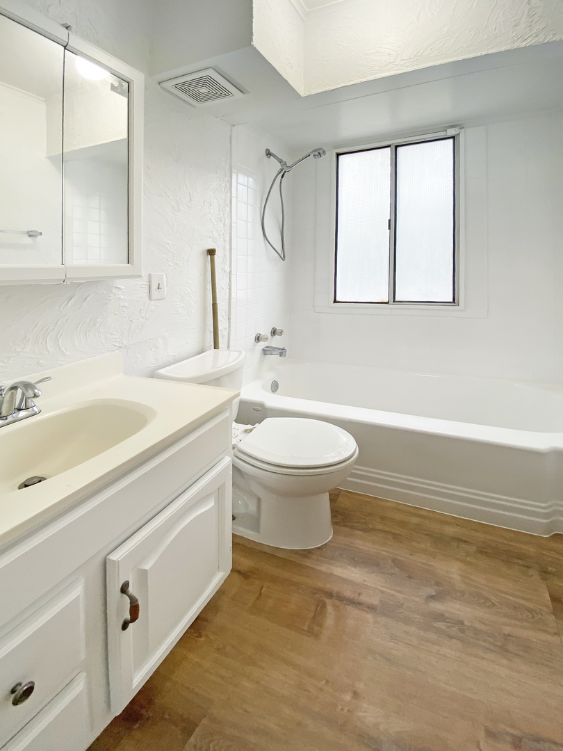 Undisclosed Address Round Lake Beach, IL 60073 - Photo 7 of 10 a bathroom with a sink toilet and shower