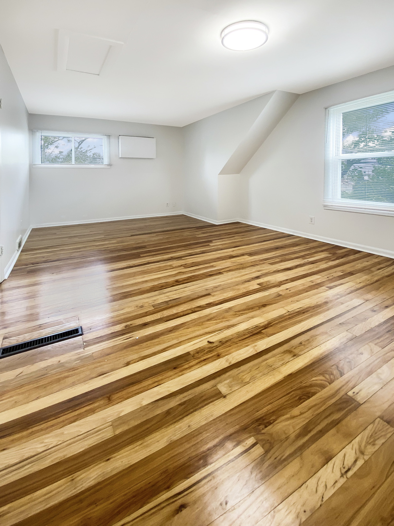 Undisclosed Address Round Lake Beach, IL 60073 - Photo 8 of 10 a view of empty room with wooden floor