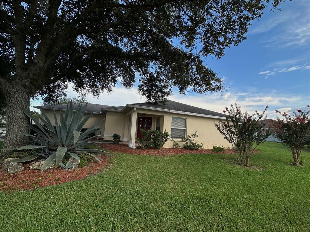 9706 Southwest 92nd Place Road Ocala, FL 34481 - Photo 38 of 82 a front view of a house with a yard and trees
