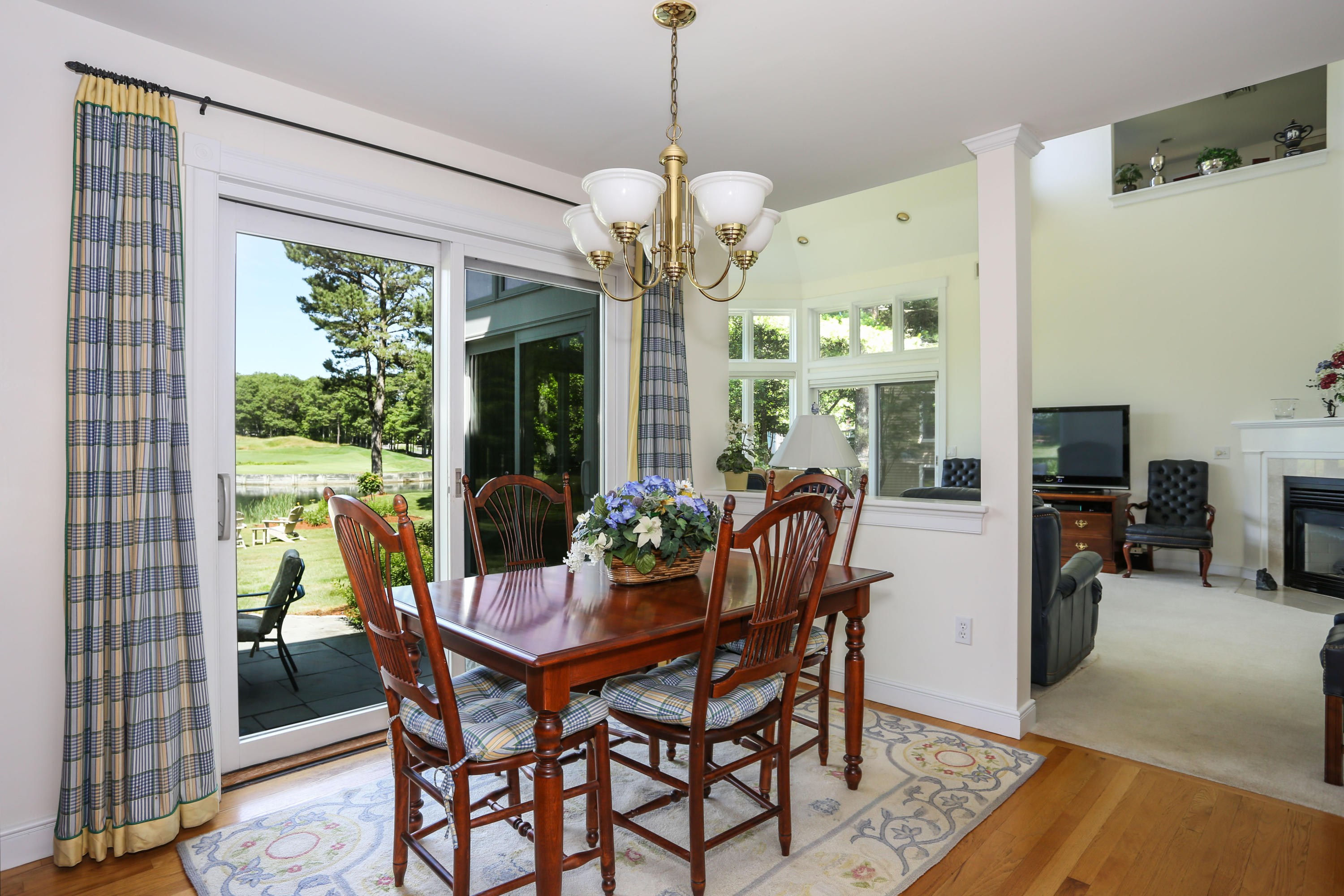 6 Reflection Drive Sandwich, MA 02563 - Photo 11 of 23 a view of a dining room with furniture wooden floor and chandelier