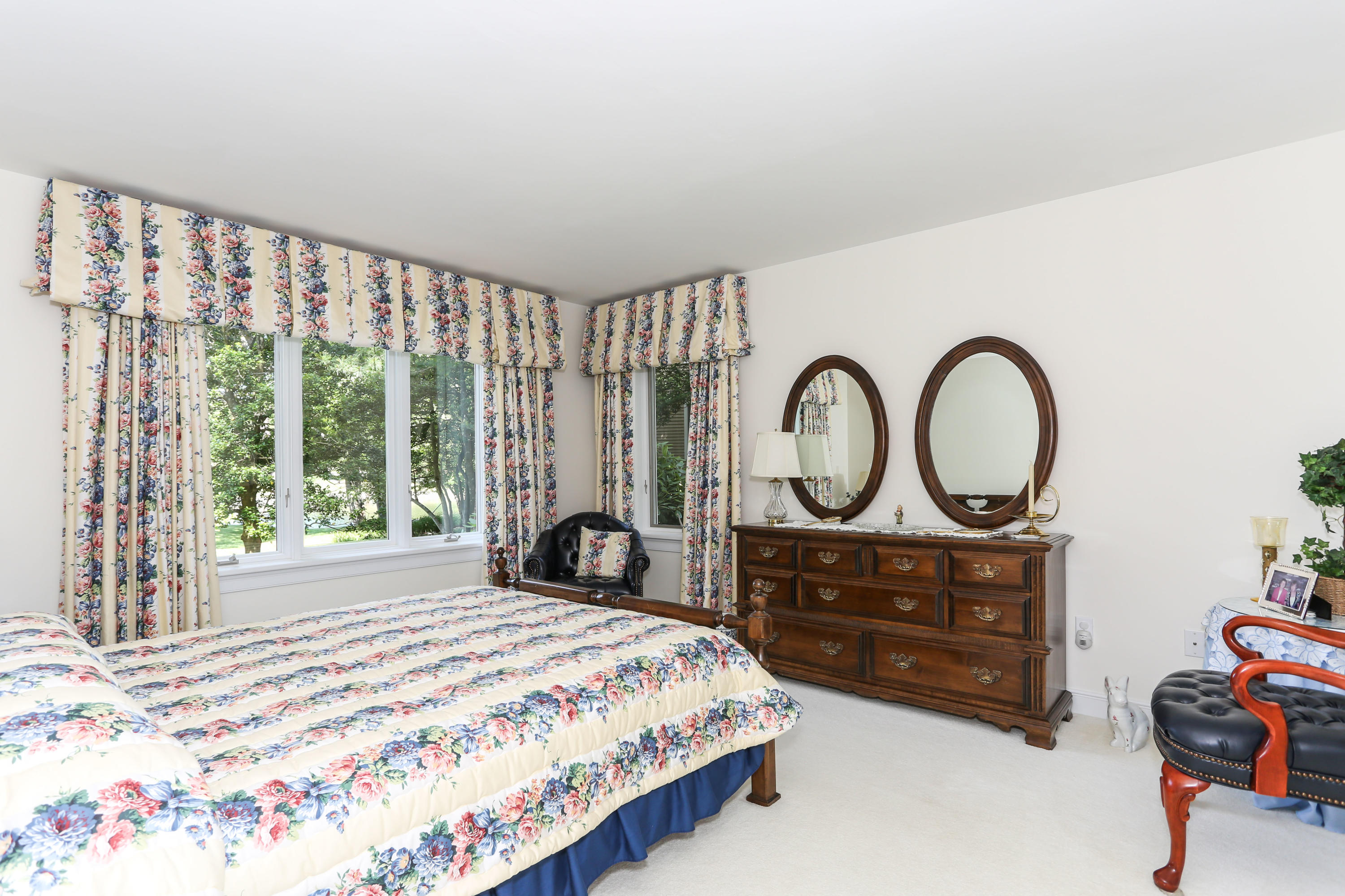 6 Reflection Drive Sandwich, MA 02563 - Photo 12 of 23 a bedroom with a bed a dresser and a large window