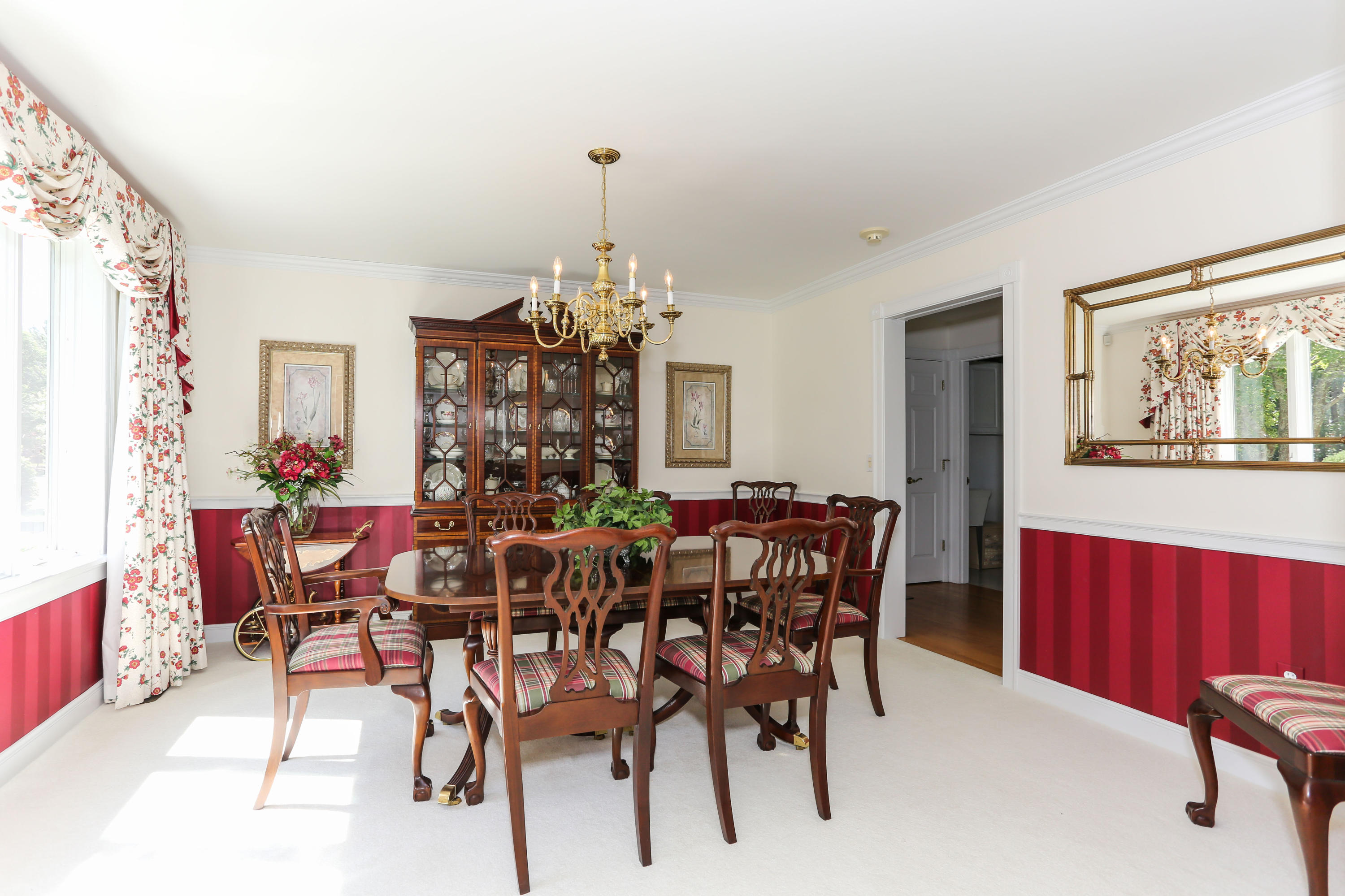 6 Reflection Drive Sandwich, MA 02563 - Photo 14 of 23 a view of a dining room with furniture and chandelier