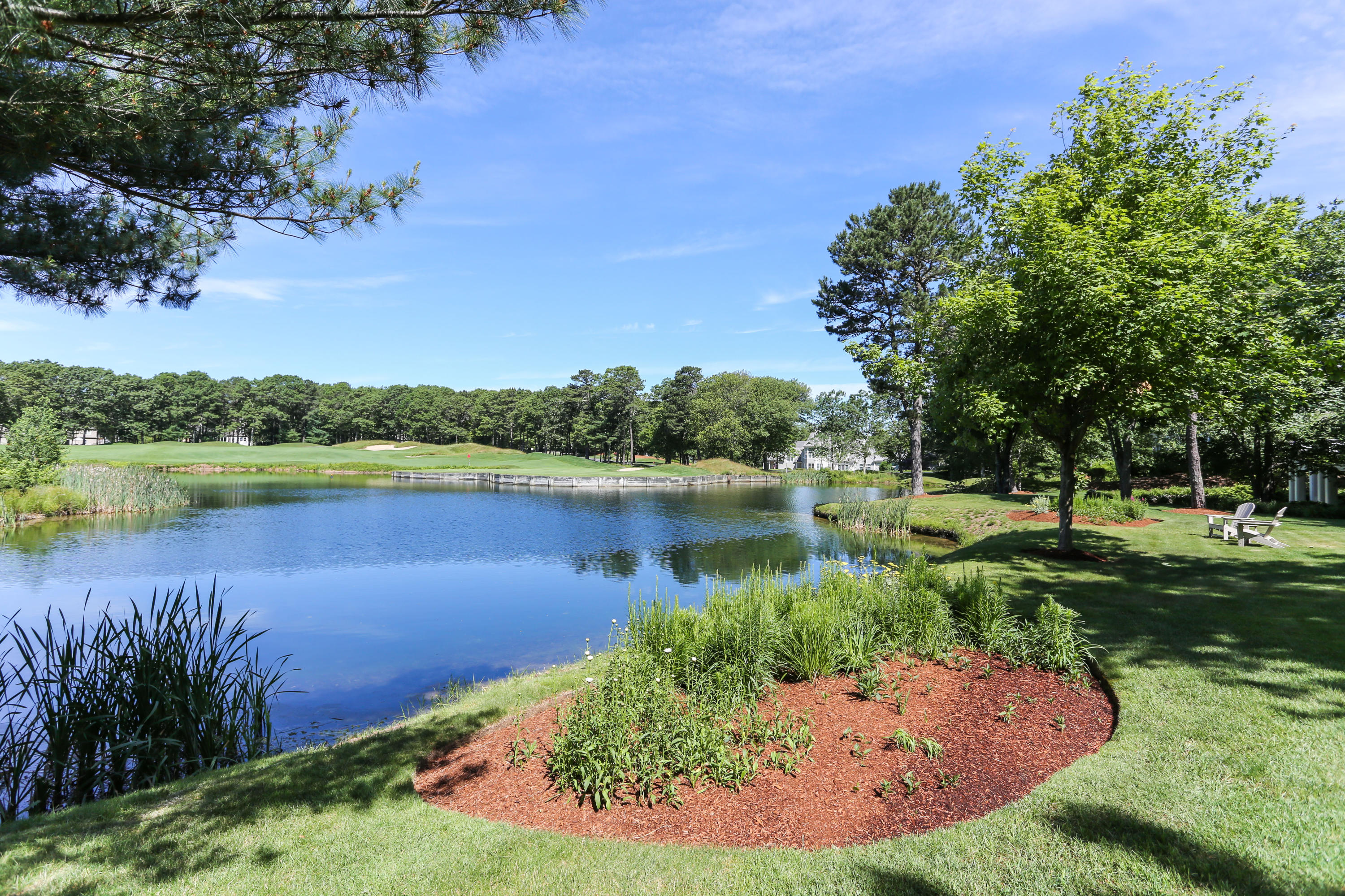 6 Reflection Drive Sandwich, MA 02563 - Photo 5 of 23 a view of a lake with a yard