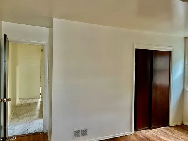 a kitchen with a refrigerator sink and cabinets