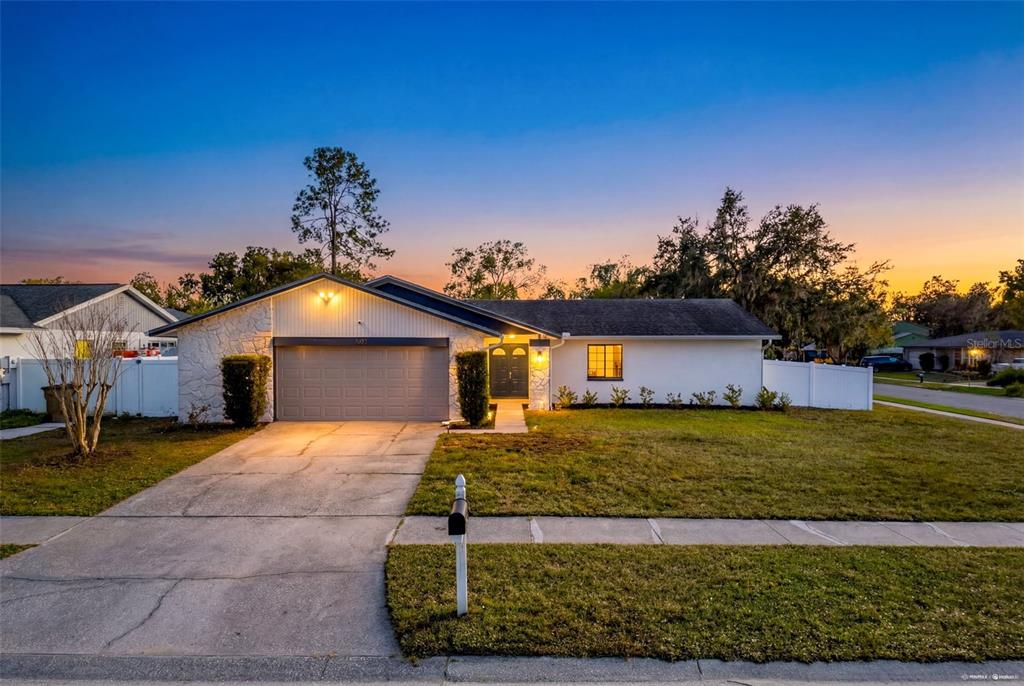 7813 River Ridge Drive Temple Terrace, FL 33637 - Photo 1 of 43 a front view of a house with a yard