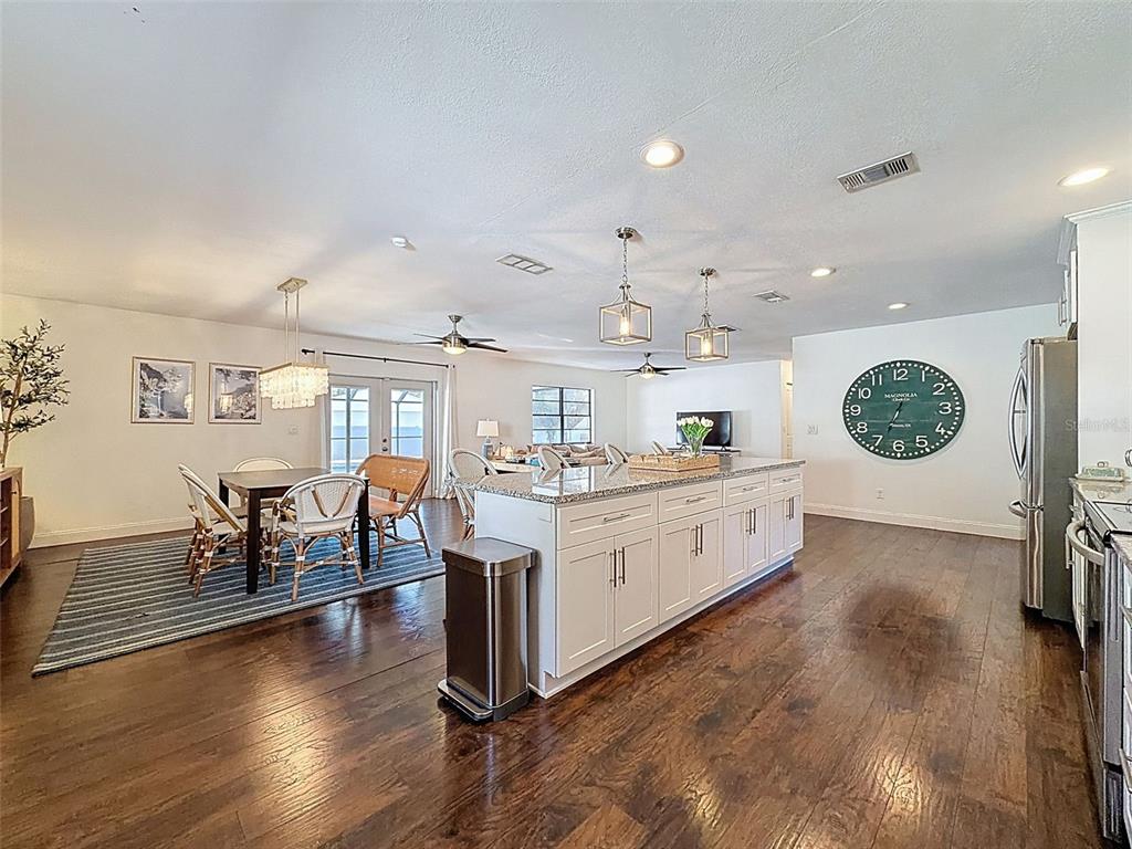 7813 River Ridge Drive Temple Terrace, FL 33637 - Photo 16 of 43 a large white kitchen with a large window and stainless steel appliances