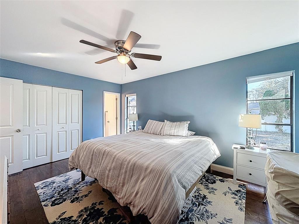 7813 River Ridge Drive Temple Terrace, FL 33637 - Photo 21 of 43 a bedroom with a bed and wooden floor