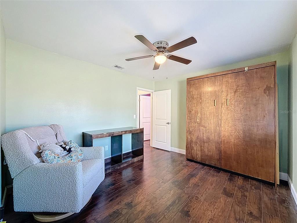 7813 River Ridge Drive Temple Terrace, FL 33637 - Photo 24 of 43 a living room with furniture and a window