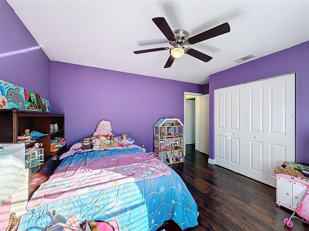 7813 River Ridge Drive Temple Terrace, FL 33637 - Photo 27 of 43 a bed room with a bed and a window