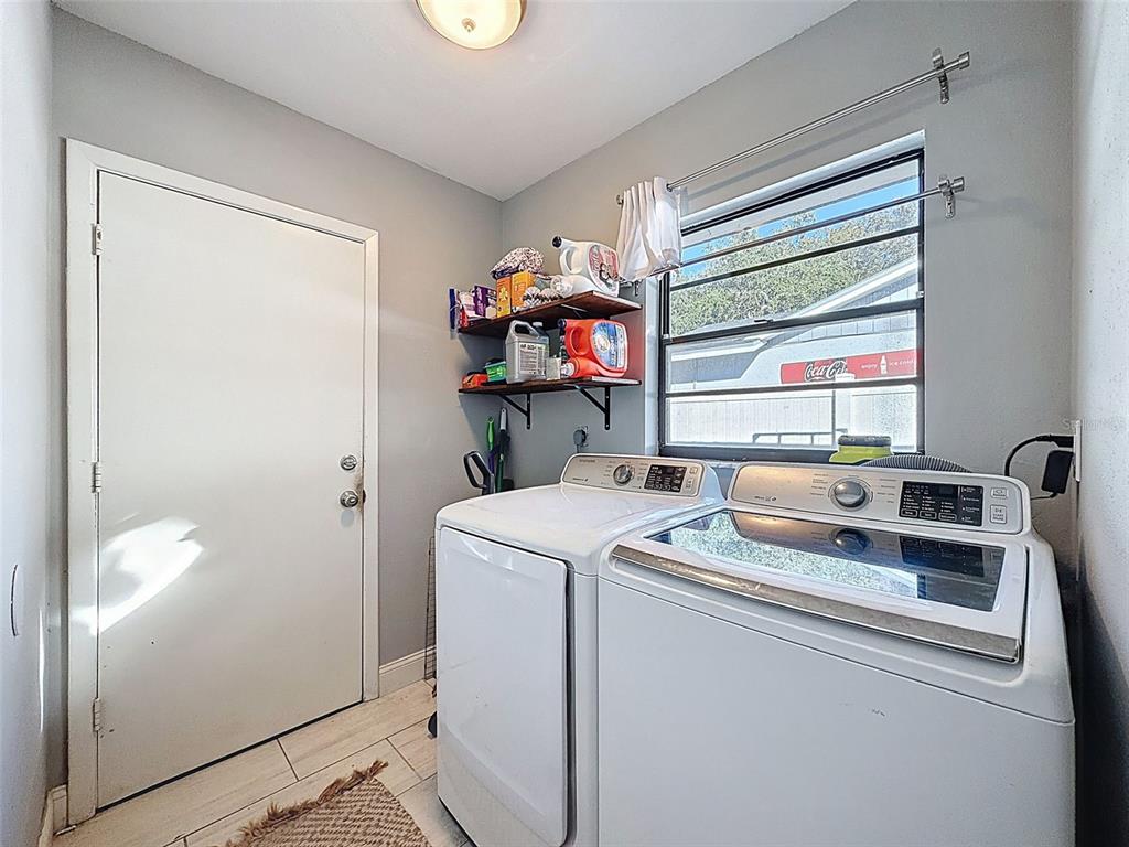 7813 River Ridge Drive Temple Terrace, FL 33637 - Photo 28 of 43 a utility room with dryer and washer
