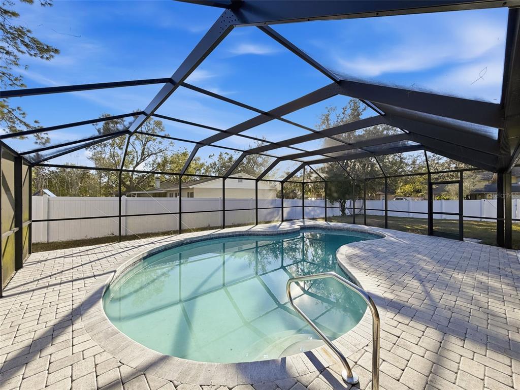 7813 River Ridge Drive Temple Terrace, FL 33637 - Photo 32 of 43 a view of a swimming pool with a patio