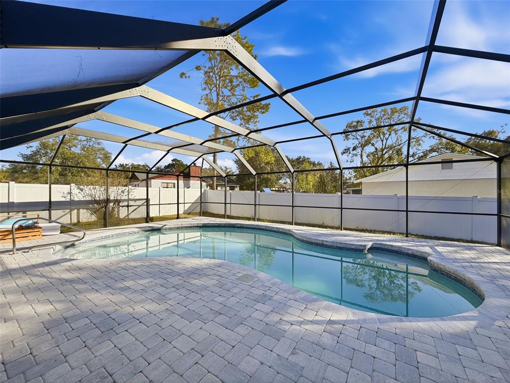 7813 River Ridge Drive Temple Terrace, FL 33637 - Photo 34 of 43 a view of a backyard with a swimming pool