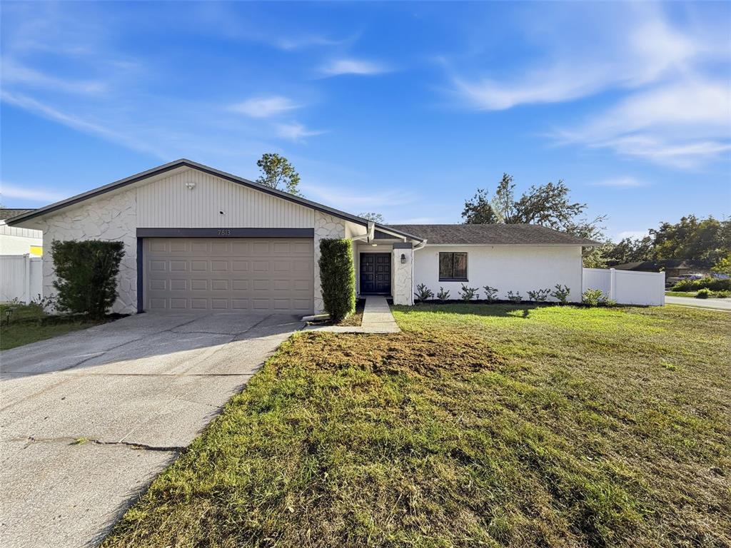 7813 River Ridge Drive Temple Terrace, FL 33637 - Photo 35 of 43 a front view of a house with a yard