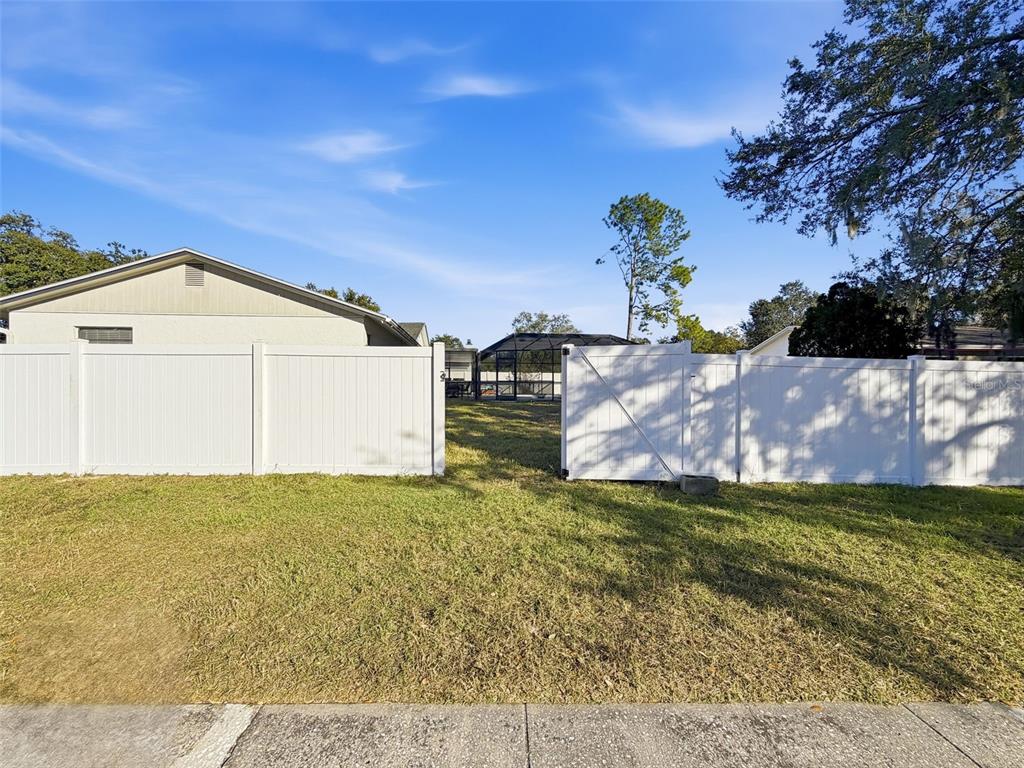 7813 River Ridge Drive Temple Terrace, FL 33637 - Photo 37 of 43 a view of a house with a yard