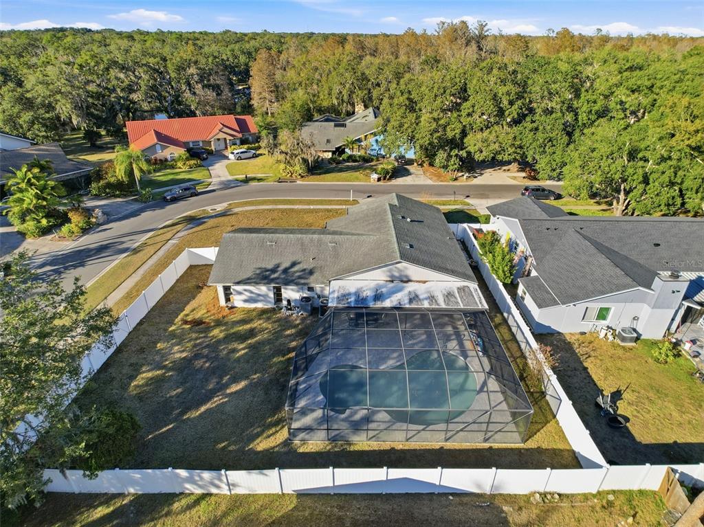 7813 River Ridge Drive Temple Terrace, FL 33637 - Photo 39 of 43 a view of a swimming pool with a yard and seating area
