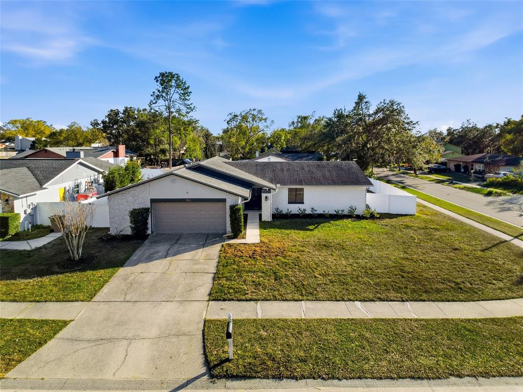 7813 River Ridge Drive Temple Terrace, FL 33637 - Photo 41 of 43 a front view of a house with a yard