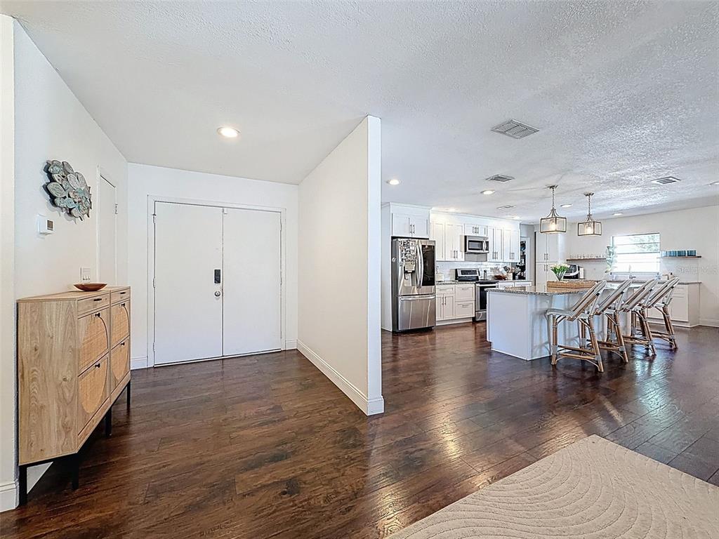 7813 River Ridge Drive Temple Terrace, FL 33637 - Photo 6 of 43 a view of a kitchen with furniture and wooden floor