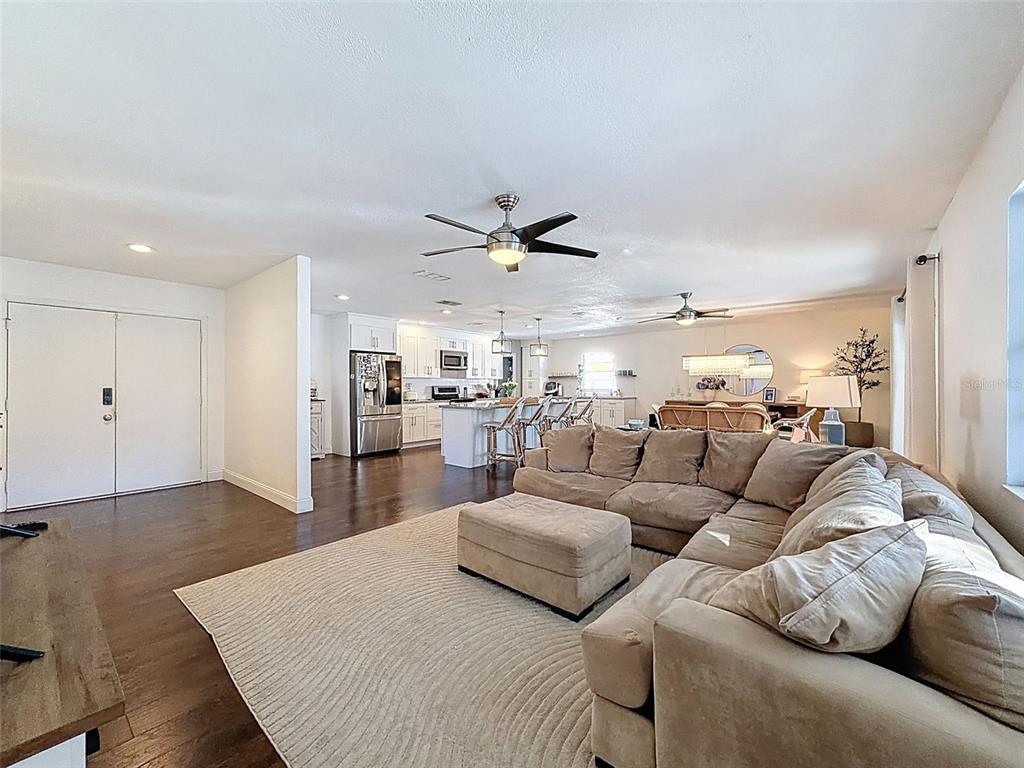 7813 River Ridge Drive Temple Terrace, FL 33637 - Photo 7 of 43 a living room with furniture and kitchen view