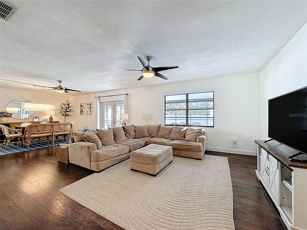 7813 River Ridge Drive Temple Terrace, FL 33637 - Photo 8 of 43 a living room with furniture and a flat screen tv