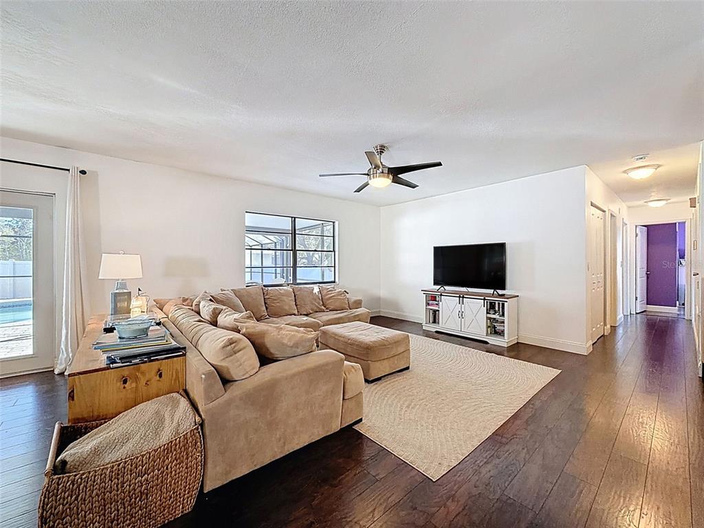 7813 River Ridge Drive Temple Terrace, FL 33637 - Photo 9 of 43 a living room with furniture and a flat screen tv
