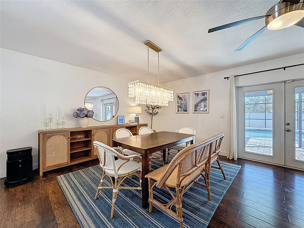 7813 River Ridge Drive Temple Terrace, FL 33637 - Photo 10 of 43 a view of a dining room with furniture and wooden floor