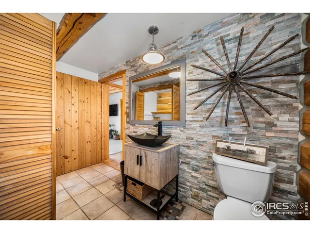 a living room with furniture a rug and a chandelier