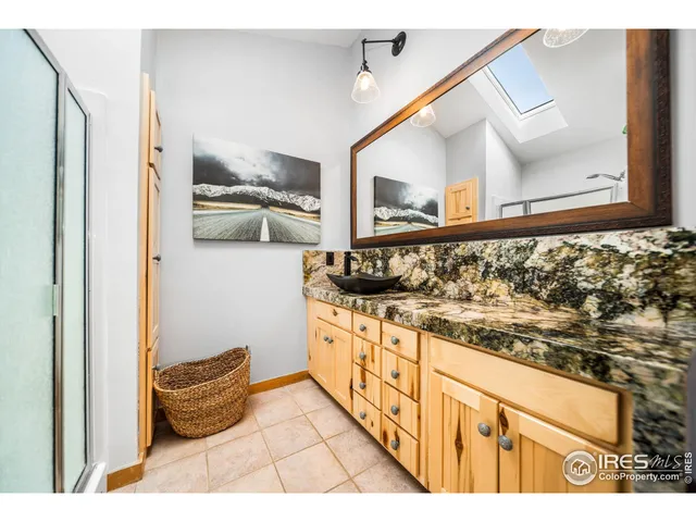 a view of a room with furniture and window