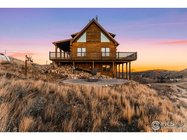 a view of balcony with wooden floor and mountain view