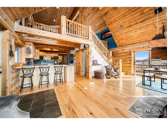a view of a living room and kitchen