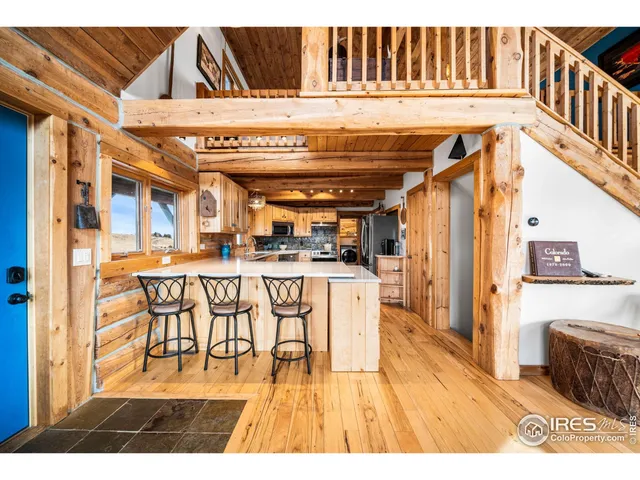 a kitchen with stainless steel appliances granite countertop a stove sink and cabinets