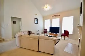 a living room with furniture and a couch
