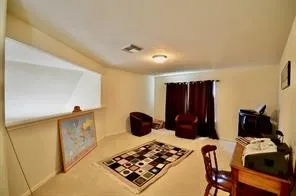 a bed sitting in a room next to a window