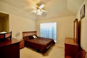 a hallway with a couch and wooden floor