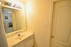 a bedroom with a bed chair and window