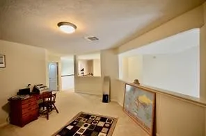 a spacious bedroom with bed and a closet