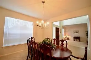 a view of living room with furniture and window