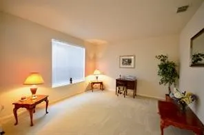 a view of a livingroom with furniture and front door