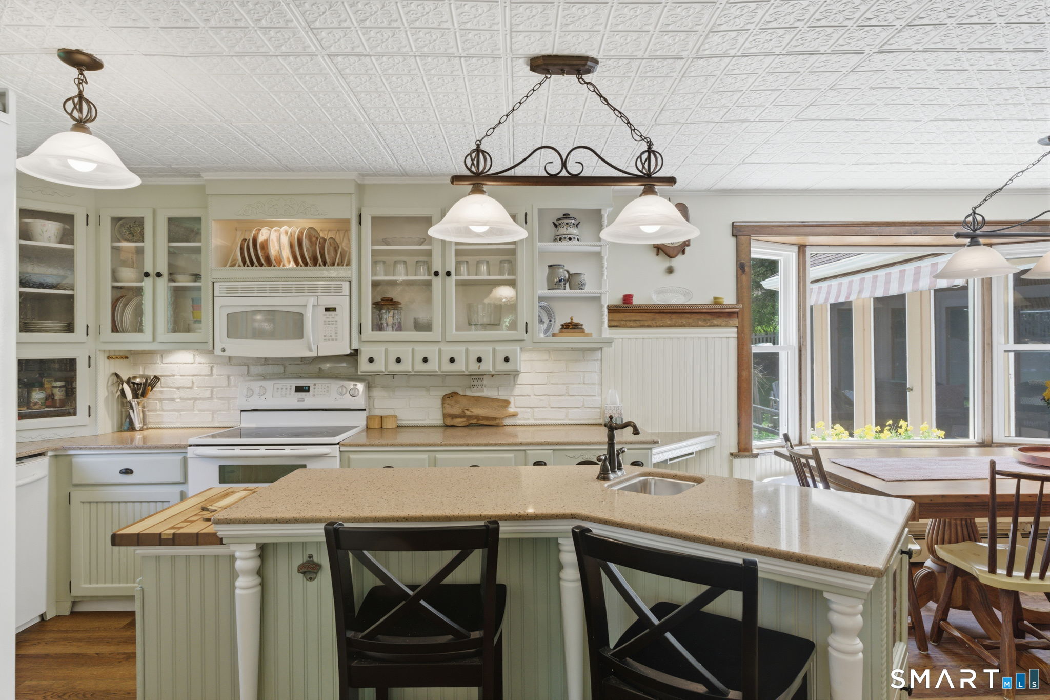 79 Buckboard Lane Bristol, CT 06010 - Photo 14 of 40 a kitchen with a sink a stove and cabinets