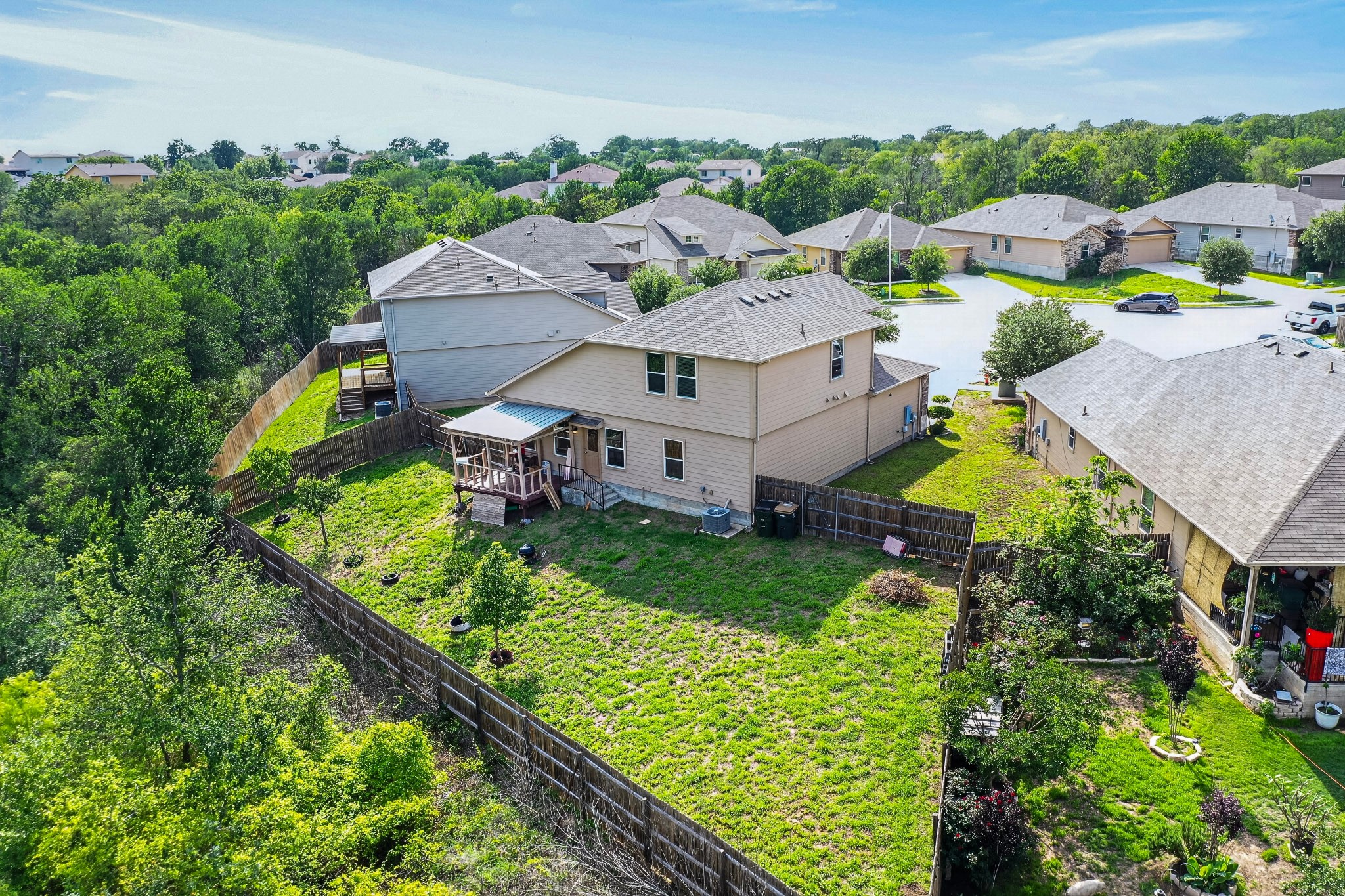 5905 Diamondleaf Bend Austin, TX 78724 - Photo 34 of 38 Spacious backyard with a wood privacy fence and established trees