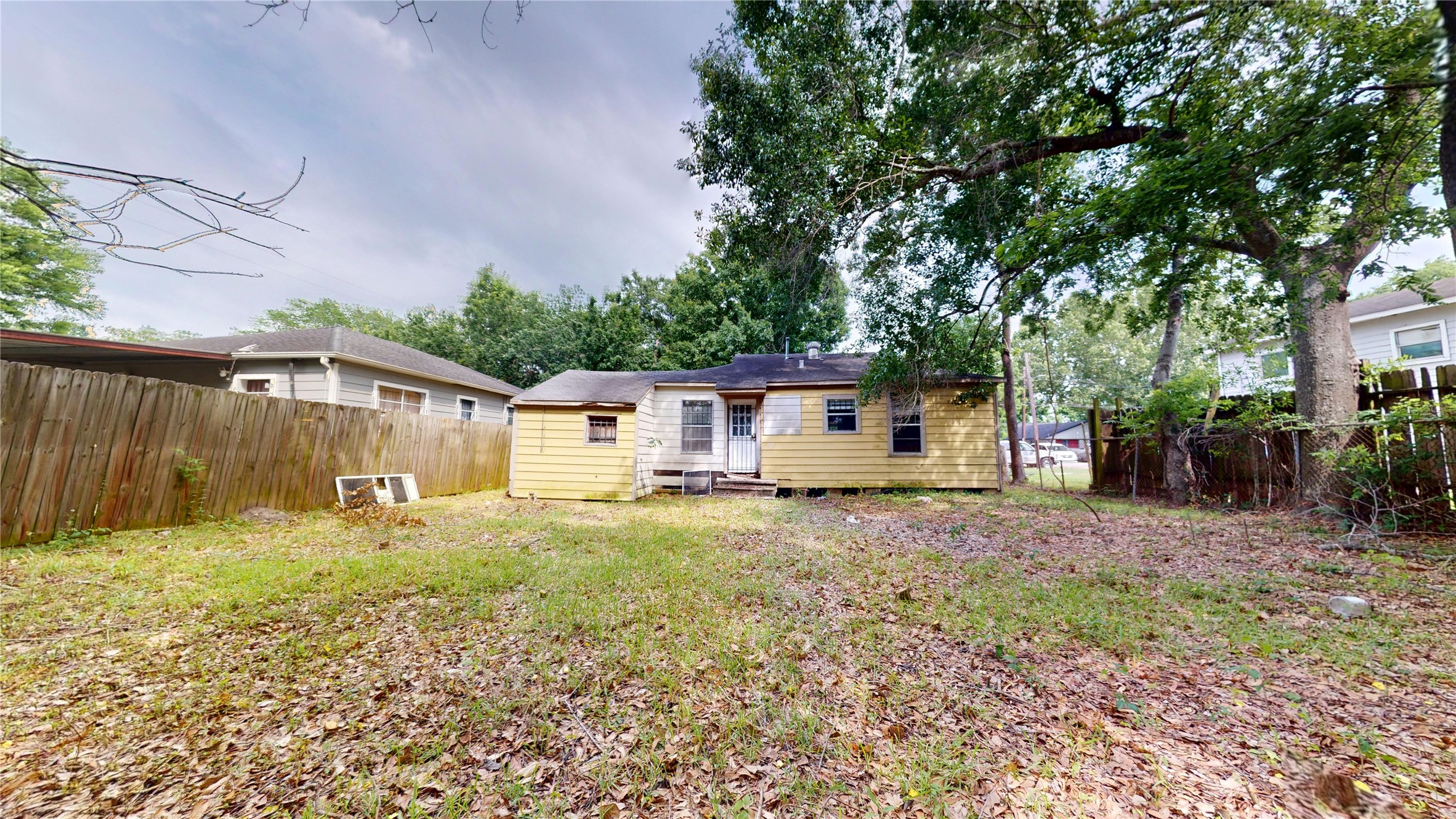6604 Conley Street Houston, TX 77021 - Photo 28 of 28 a house with trees in the background