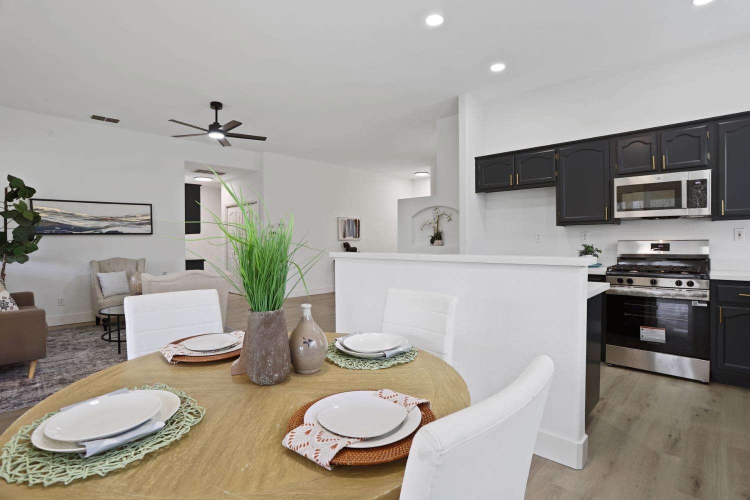 1829 Nighthawk Circle Roseville, CA 95661 - Photo 11 of 34 a kitchen with stainless steel appliances a dining table and chairs