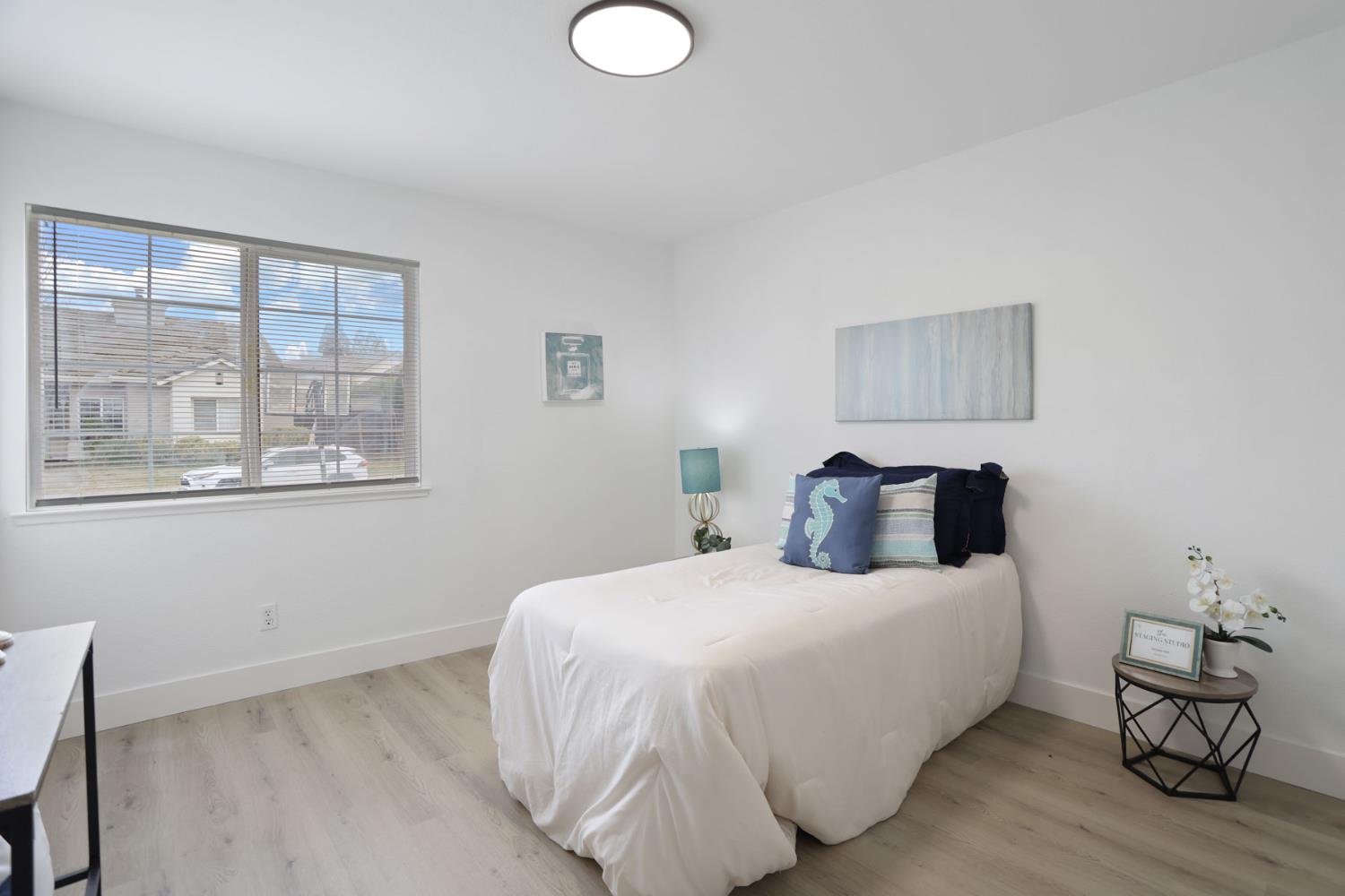 1829 Nighthawk Circle Roseville, CA 95661 - Photo 20 of 34 a bedroom with a bed and wooden floor