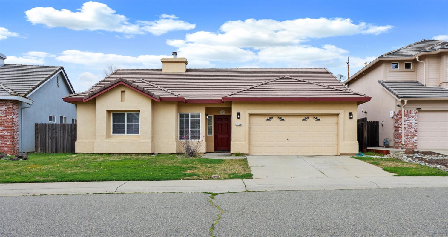 1829 Nighthawk Circle Roseville, CA 95661 - Photo 2 of 34 a view of a house with a yard and garage