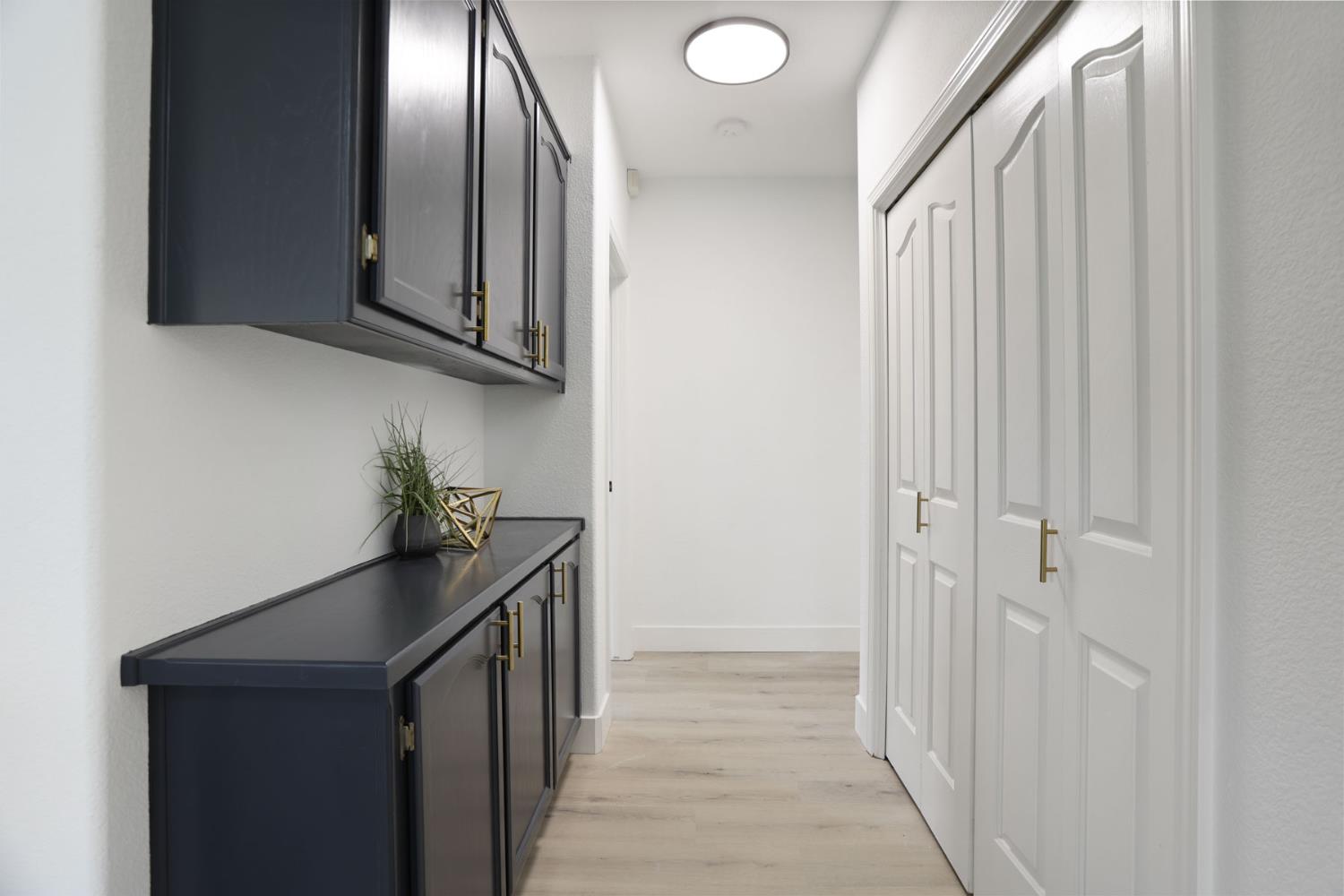 1829 Nighthawk Circle Roseville, CA 95661 - Photo 22 of 34 a view of a hallway with wooden floor