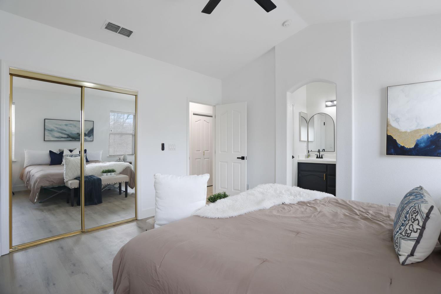 1829 Nighthawk Circle Roseville, CA 95661 - Photo 25 of 34 a bedroom with a bed and a mirror