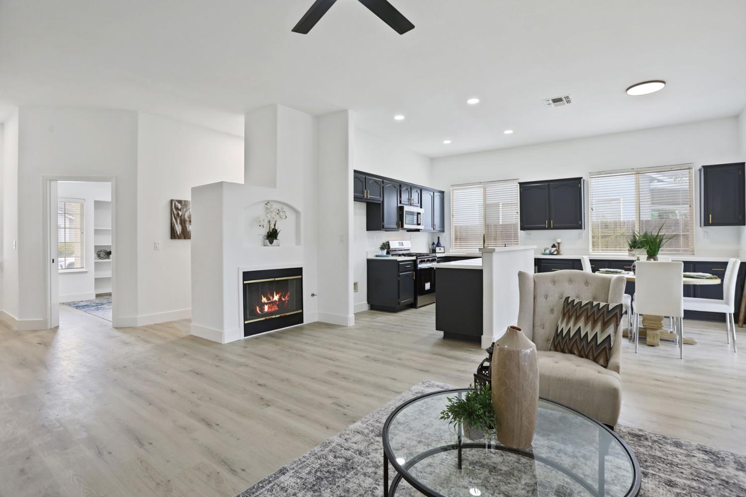 1829 Nighthawk Circle Roseville, CA 95661 - Photo 9 of 34 a living room with furniture a fireplace and a flat screen tv
