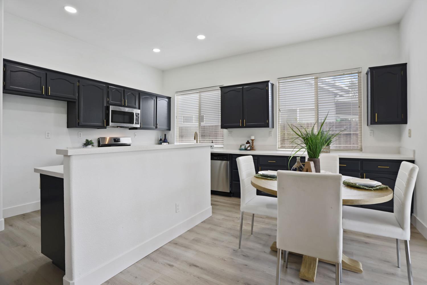 1829 Nighthawk Circle Roseville, CA 95661 - Photo 10 of 34 a dining room with furniture a fireplace and a flat screen tv