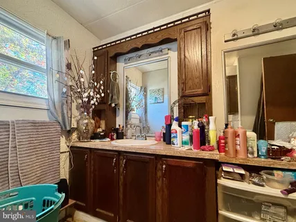 a bathroom with a sink and a mirror