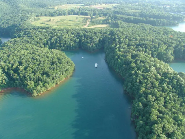 a view of a lake with a yard